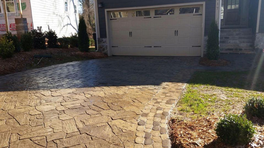 Paved driveway leading to a residential garage.